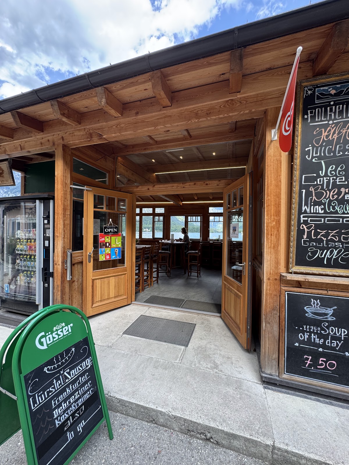 Tera Hen Cafe entrance with open sign and sausage menu